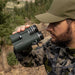 The Hawke FRONTIER ED X 8X42 binoculars being used by a hunter